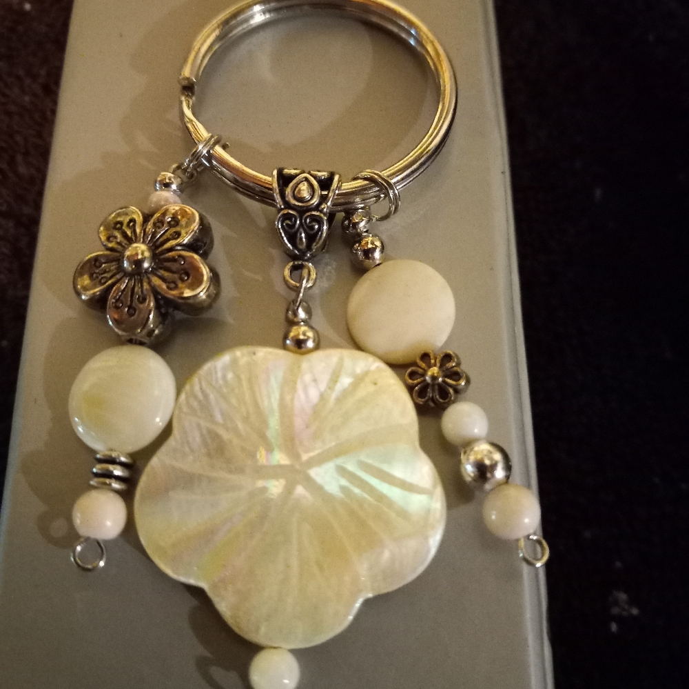 Handmade Flower  shell  Keychain with two  hanging  silver  flower 🌸 beads.